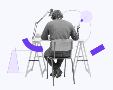 Person working at a desk while the website is unavailable